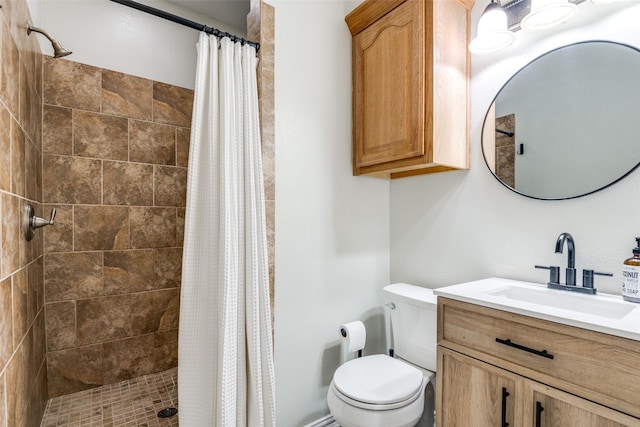 bathroom featuring vanity, toilet, and curtained shower