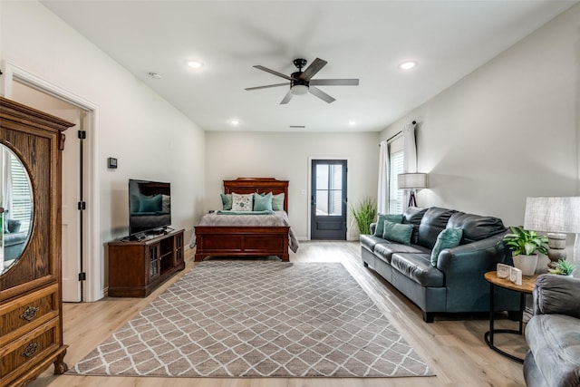 bedroom with light hardwood / wood-style floors and ceiling fan