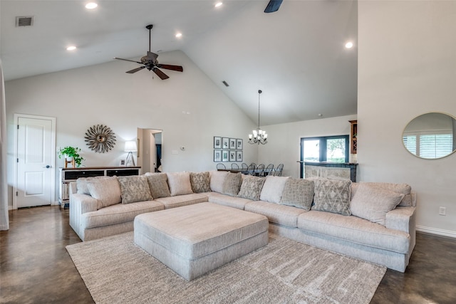 living room featuring high vaulted ceiling and ceiling fan with notable chandelier