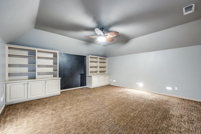 unfurnished living room featuring ceiling fan, light carpet, and lofted ceiling