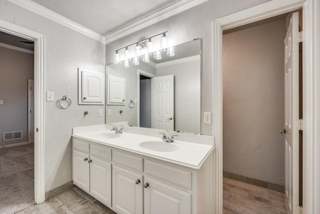 bathroom with vanity and ornamental molding