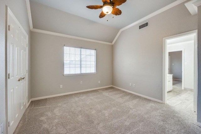 spare room with light carpet, ceiling fan, lofted ceiling, and ornamental molding