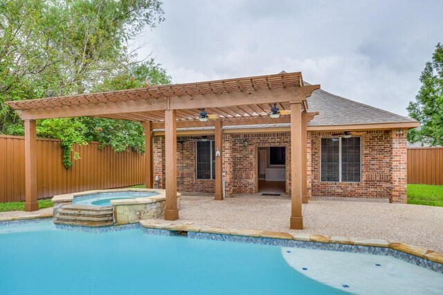 view of pool with an in ground hot tub, a patio area, and a pergola