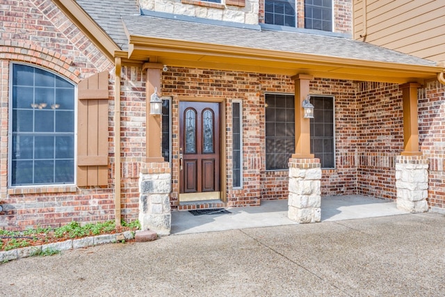 entrance to property featuring covered porch