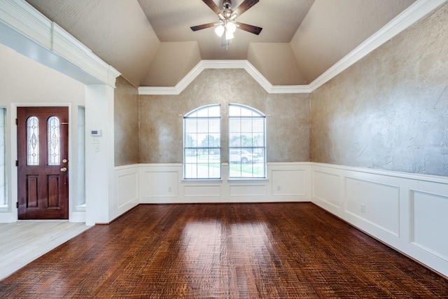 entryway featuring ceiling fan, dark hardwood / wood-style flooring, ornamental molding, and vaulted ceiling