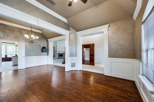 unfurnished room with hardwood / wood-style flooring, ceiling fan with notable chandelier, ornamental molding, and lofted ceiling