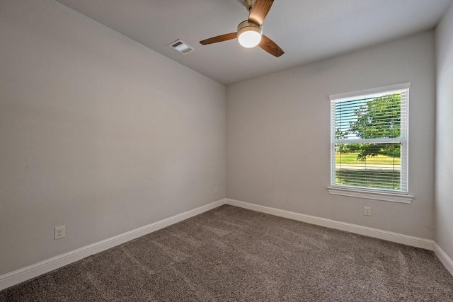 empty room with ceiling fan and carpet flooring