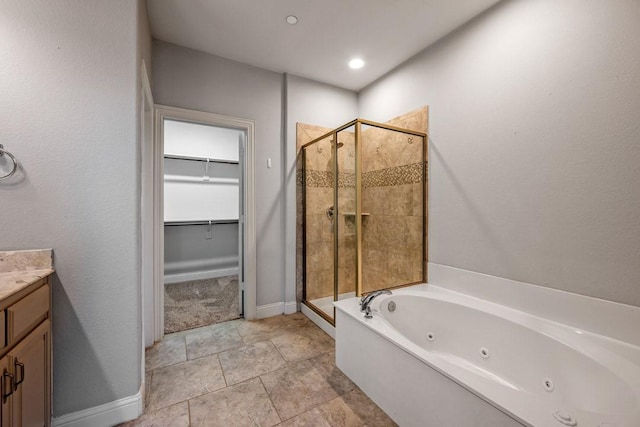 bathroom featuring vanity and shower with separate bathtub