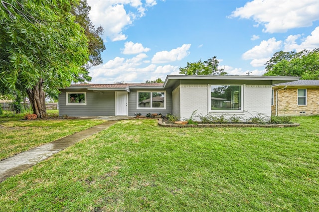 ranch-style house with a front lawn