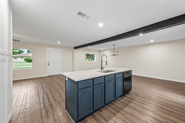 kitchen featuring black dishwasher, beamed ceiling, hardwood / wood-style floors, sink, and light stone counters