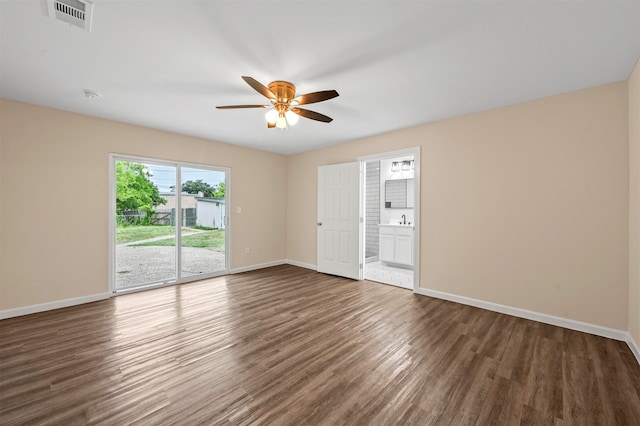 unfurnished bedroom featuring hardwood / wood-style flooring, access to outside, and ceiling fan