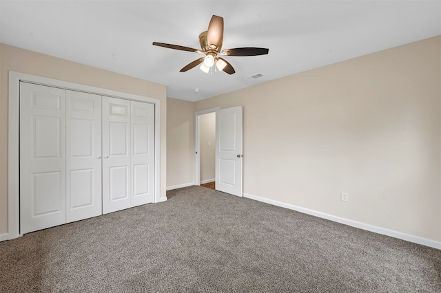 unfurnished bedroom featuring a closet, carpet floors, and ceiling fan