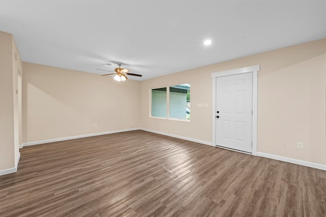 empty room with wood-type flooring and ceiling fan