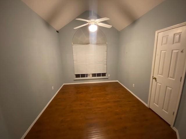 unfurnished room featuring ceiling fan, wood-type flooring, and vaulted ceiling