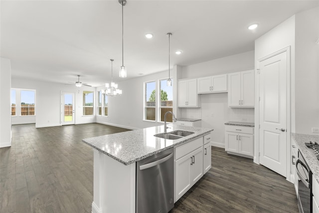 kitchen featuring dishwasher, a wealth of natural light, sink, and white cabinets