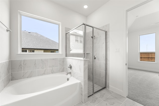 bathroom with plus walk in shower and plenty of natural light