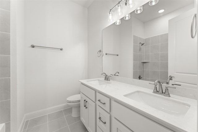 bathroom with vanity, tile patterned flooring, and toilet