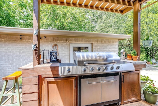 view of patio with grilling area and exterior kitchen
