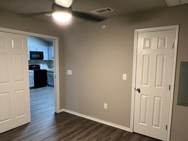 hallway featuring dark hardwood / wood-style flooring