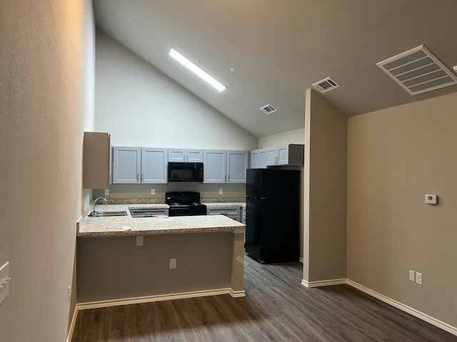 kitchen featuring high vaulted ceiling, kitchen peninsula, dark hardwood / wood-style flooring, and black appliances