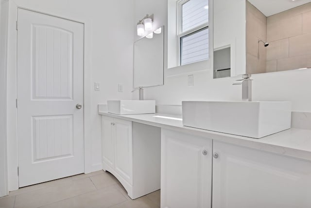 bathroom with tile patterned flooring and vanity