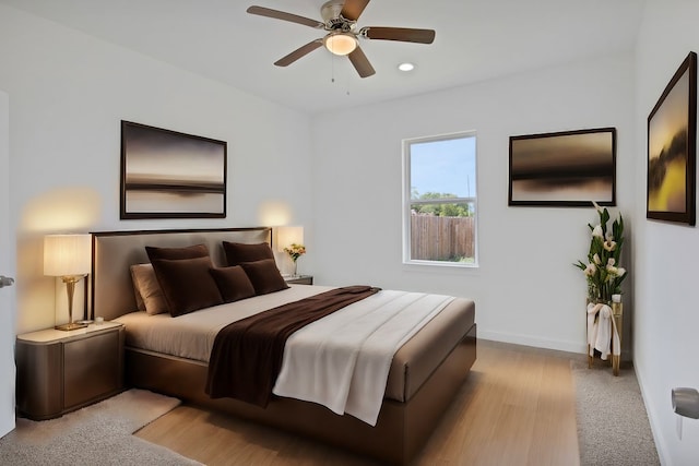 bedroom featuring light wood-type flooring and ceiling fan