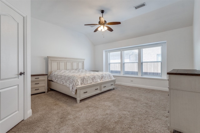 bedroom featuring vaulted ceiling, ceiling fan, and light colored carpet