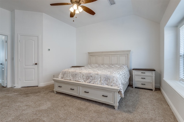 bedroom featuring ceiling fan, light carpet, and lofted ceiling