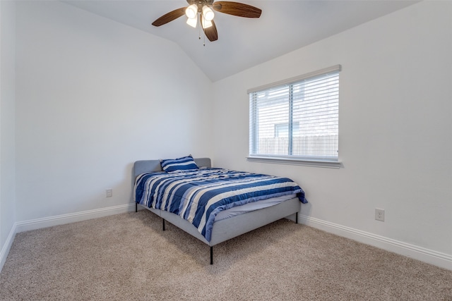 bedroom featuring ceiling fan, light colored carpet, and lofted ceiling