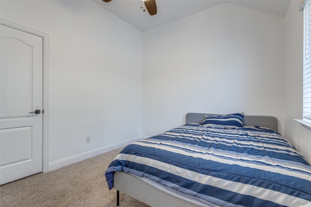 bedroom featuring ceiling fan, lofted ceiling, and carpet flooring