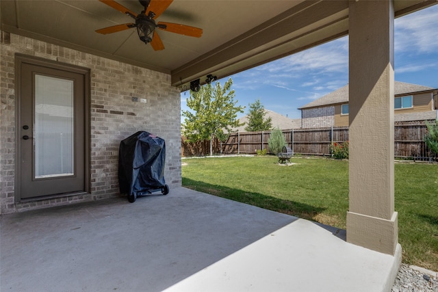 view of patio featuring ceiling fan and a grill