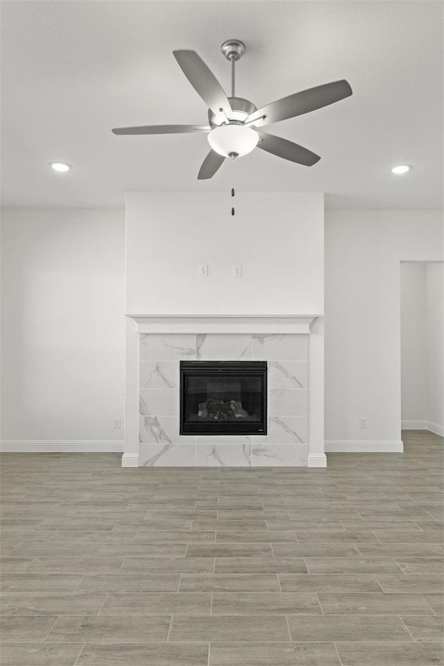 details with hardwood / wood-style floors, ceiling fan, and a fireplace