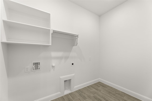 laundry area featuring gas dryer hookup, hardwood / wood-style flooring, hookup for a washing machine, and electric dryer hookup