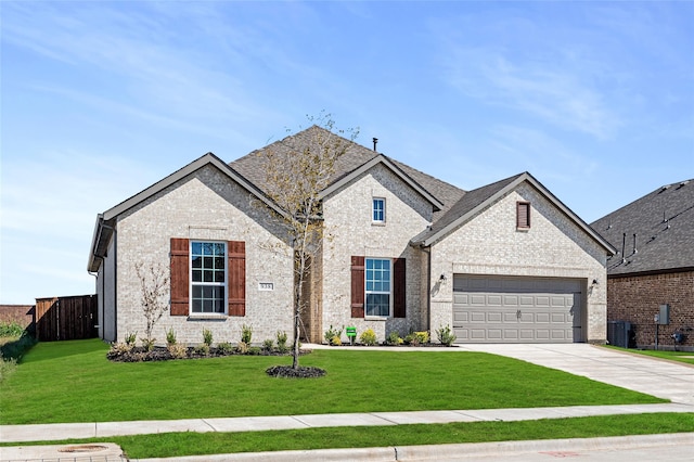 french country style house featuring a front yard