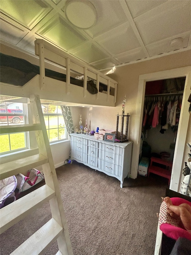 carpeted bedroom featuring a closet