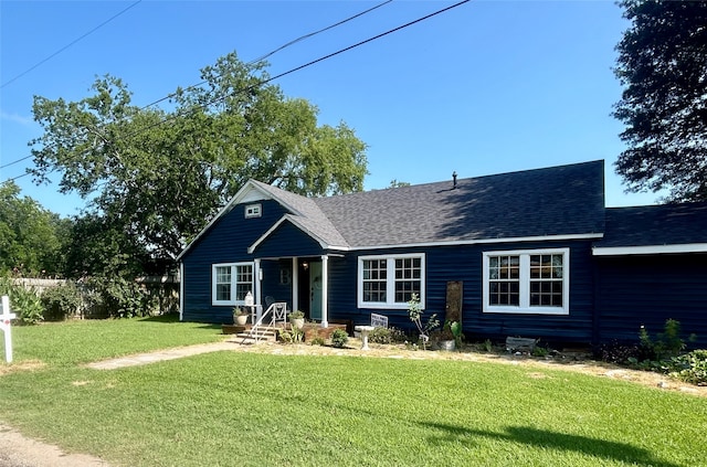 view of front of home with a front yard