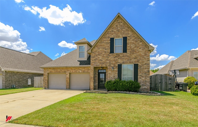 front of property with a garage and a front lawn