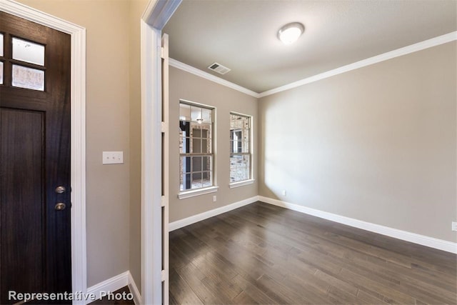 entrance foyer with dark hardwood / wood-style floors and crown molding