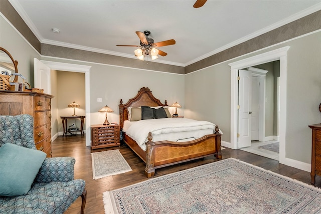 bedroom featuring ceiling fan, dark wood-type flooring, and crown molding