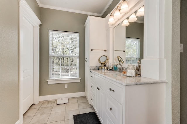 bathroom featuring a wealth of natural light, crown molding, tile patterned floors, and vanity