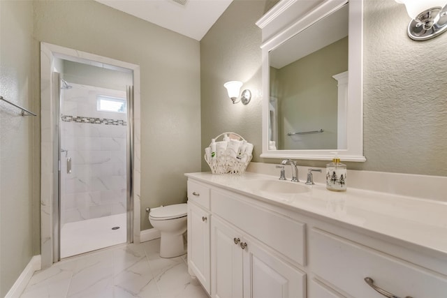 bathroom featuring toilet, a shower with shower door, and vanity