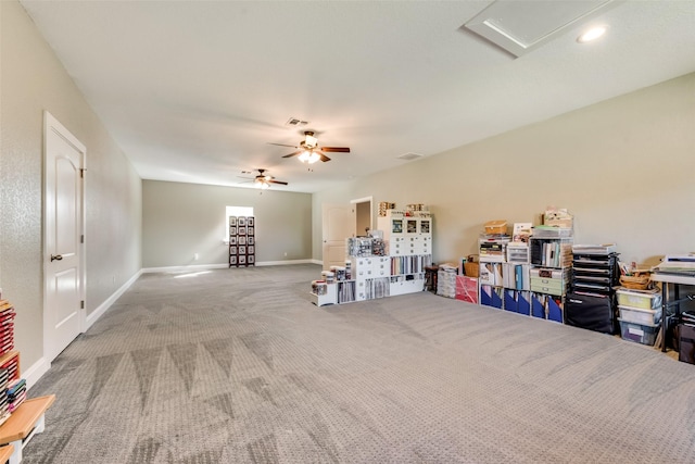 rec room featuring carpet floors and ceiling fan