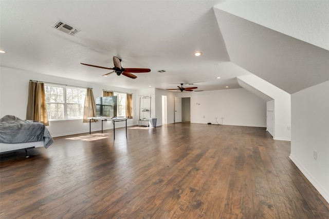 interior space featuring ceiling fan, dark hardwood / wood-style flooring, and lofted ceiling