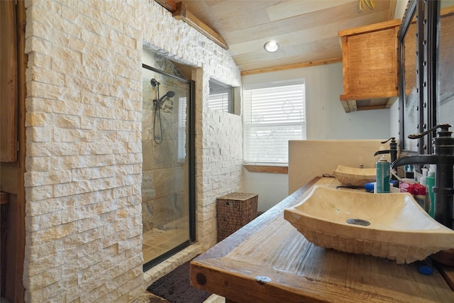 bathroom featuring lofted ceiling, sink, a shower with door, and wood ceiling