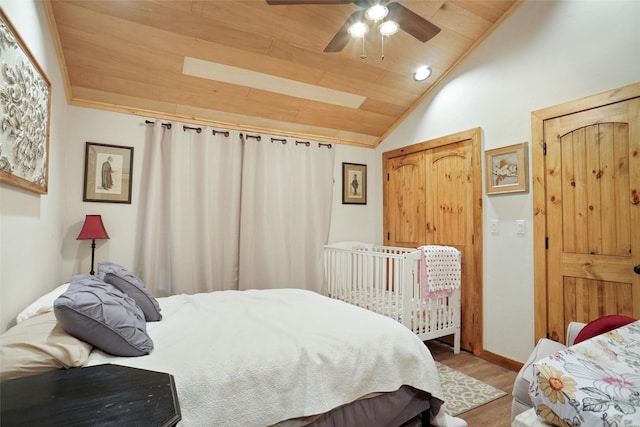 bedroom with ceiling fan, wooden ceiling, lofted ceiling, and hardwood / wood-style flooring