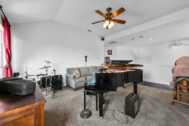 playroom featuring lofted ceiling, dark carpet, and ceiling fan