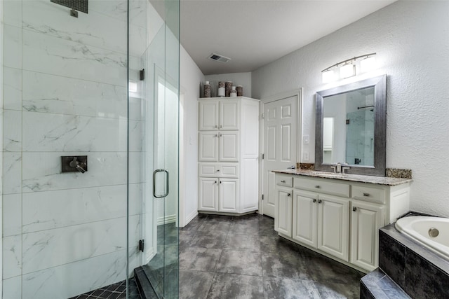 bathroom with shower with separate bathtub and vanity