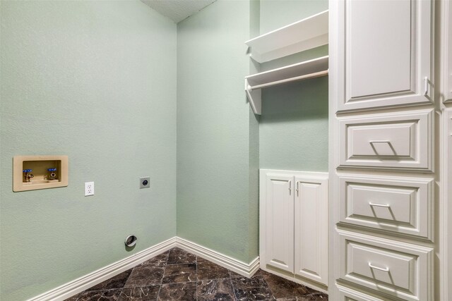 washroom featuring cabinets, washer hookup, and electric dryer hookup