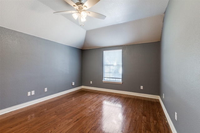 unfurnished room featuring ceiling fan, vaulted ceiling, and hardwood / wood-style floors