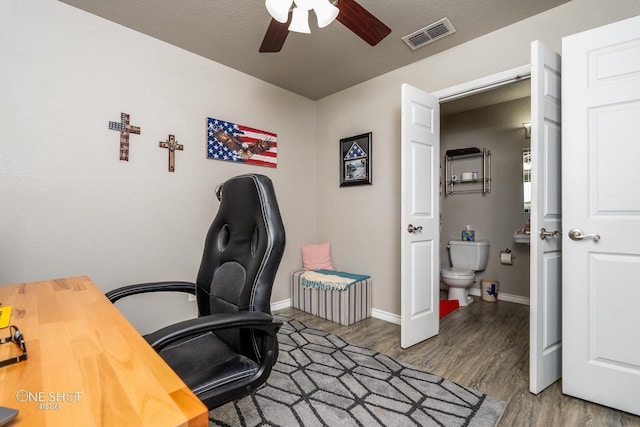 office area with ceiling fan and hardwood / wood-style floors